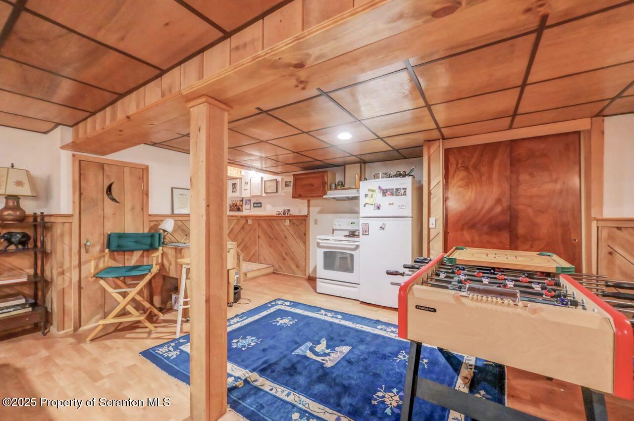 242 Shore Drive Hop Bottom, PA 18824 - Photo 77 of 120 a view of an empty room with wooden floor and next to a window