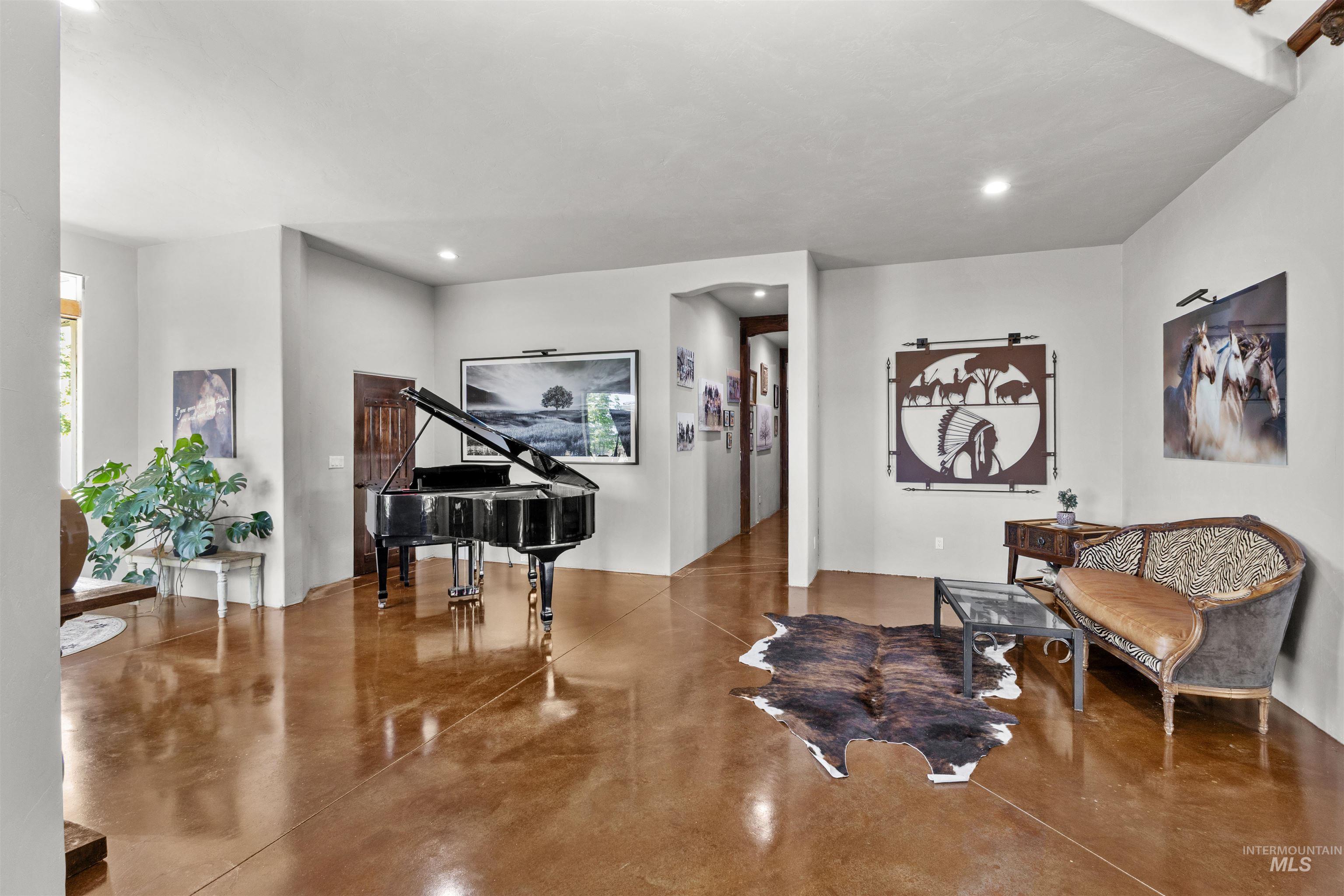 1030 Desert Glen Road Adrian, OR 97901 - Photo 18 of 47 Polished concrete flooring extends through this expansive room, featuring high ceilings and recessed lighting