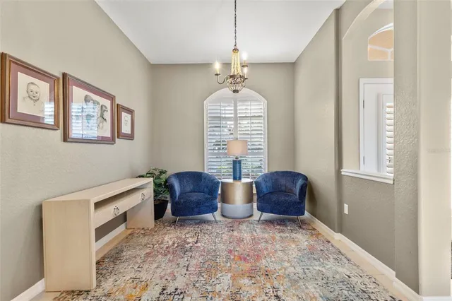 a hallway with furniture and a window