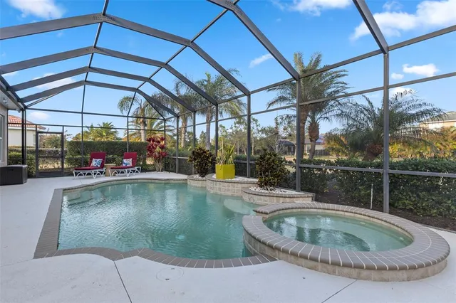 a view of a swimming pool with a yard