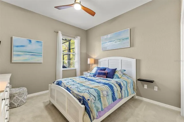 a bedroom with bed and a window