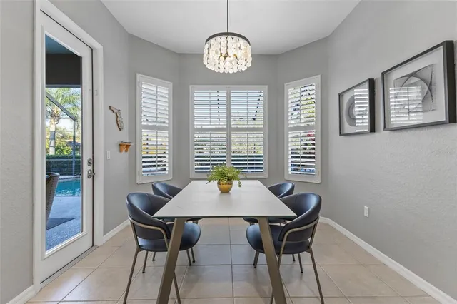 a dining room with furniture and window