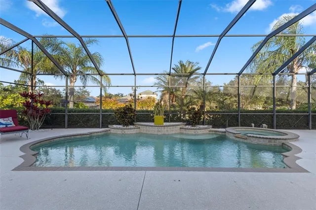 a view of a swimming pool with a yard