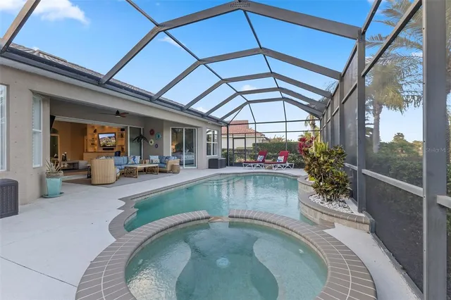 a view of swimming pool with outdoor seating