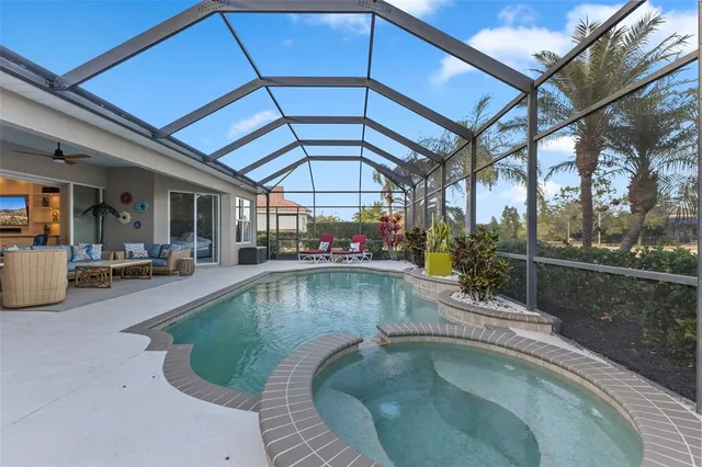 a view of a swimming pool with a patio