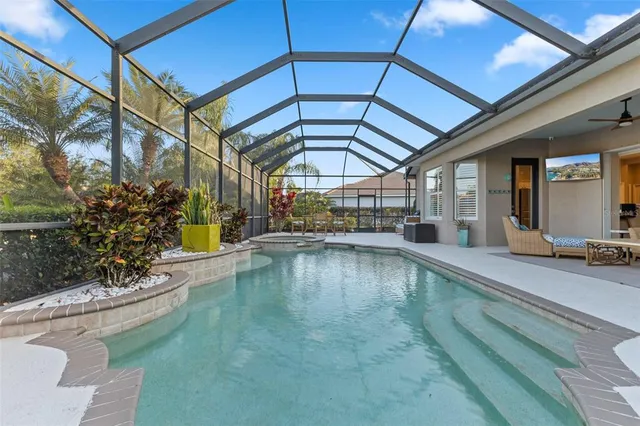 a view of a swimming pool with a patio
