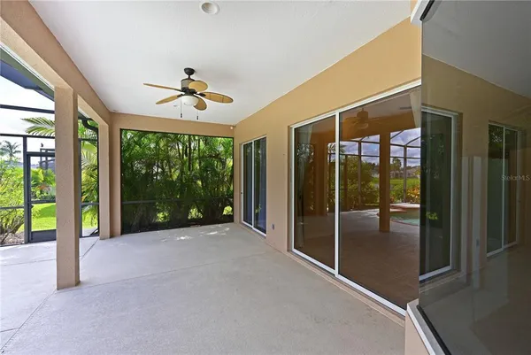 a view of an empty room with windows