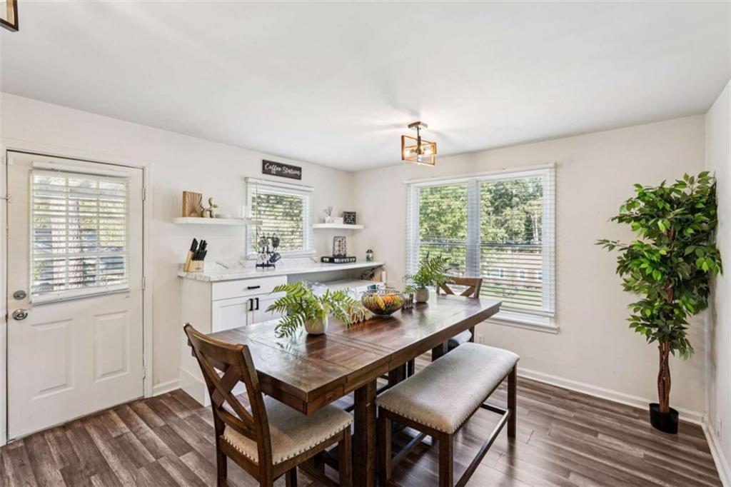 3465 Glen Road Decatur, GA 30032 - Photo 14 of 33 a view of a dining room with furniture window and wooden floor