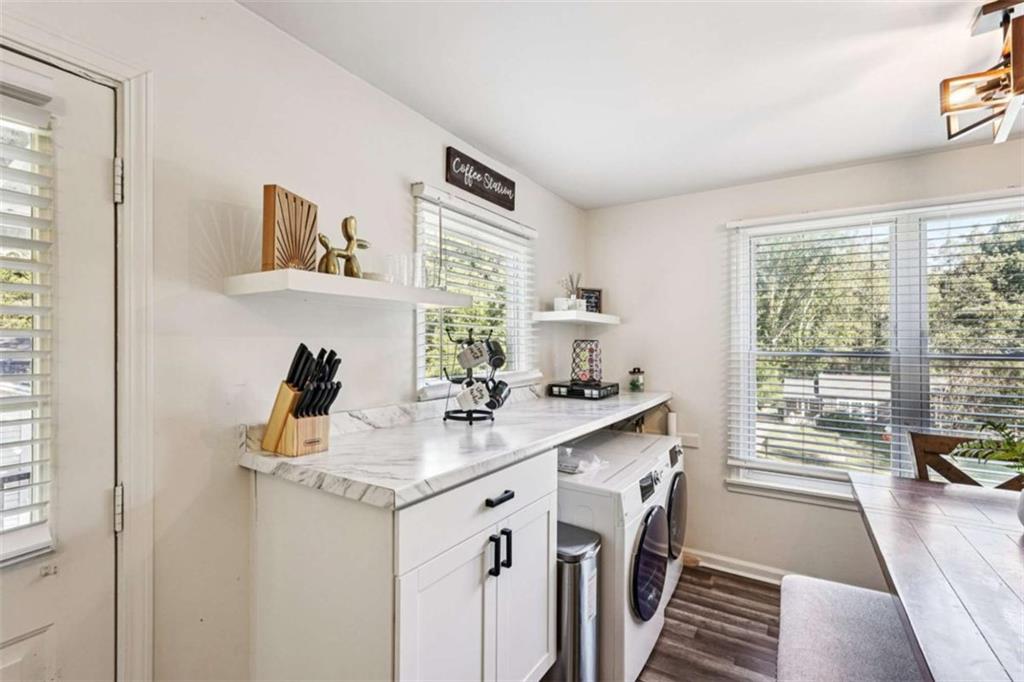 3465 Glen Road Decatur, GA 30032 - Photo 17 of 33 a view of washer and dryer with kitchen area