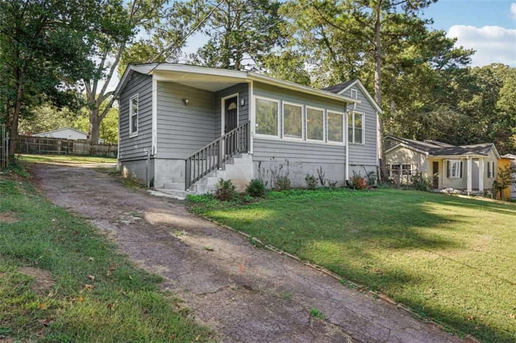 3465 Glen Road Decatur, GA 30032 - Photo 2 of 33 a view of a house with yard and a garden