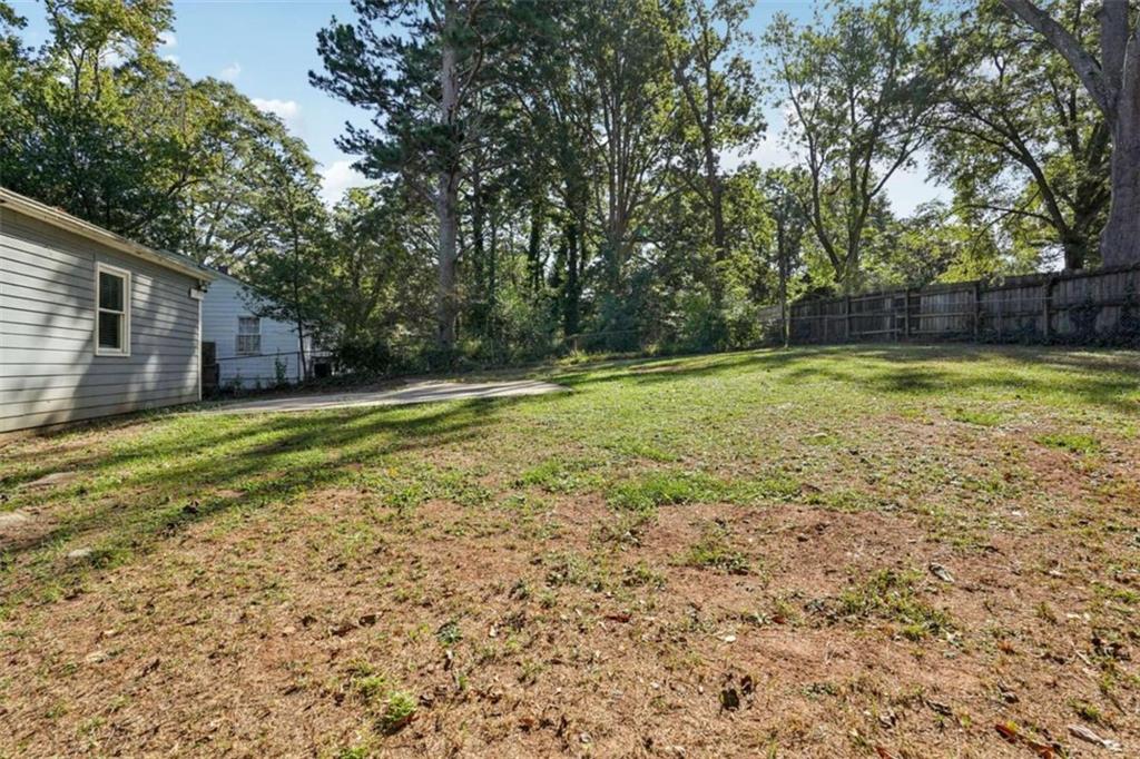 3465 Glen Road Decatur, GA 30032 - Photo 30 of 33 a view of a backyard with large trees