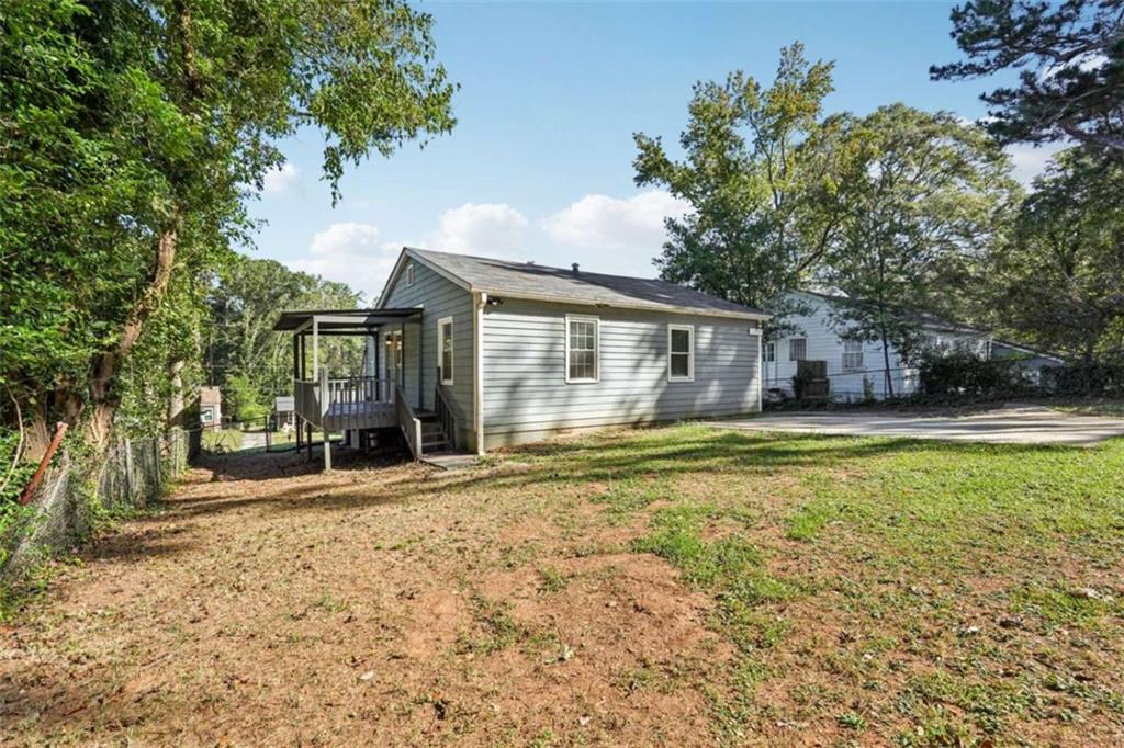 3465 Glen Road Decatur, GA 30032 - Photo 31 of 33 a view of a house with a yard and large tree