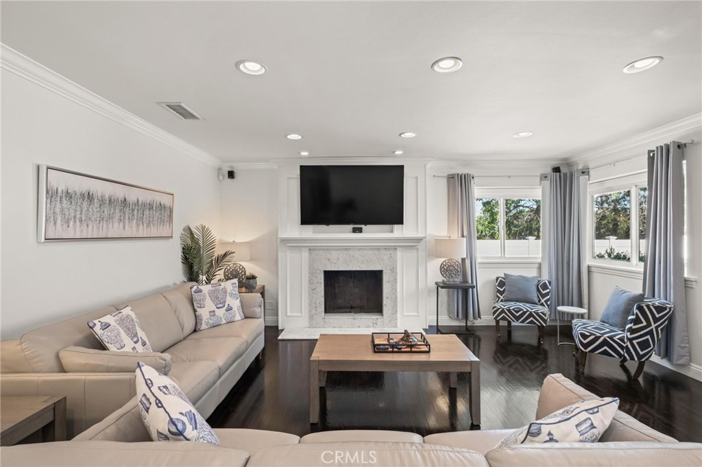 2219 Estribo Drive Rolling Hills Estates, CA 90274 - Photo 12 of 58 a living room with furniture a fireplace and a flat screen tv