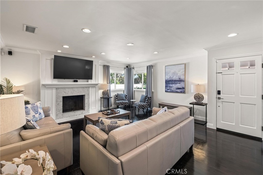 2219 Estribo Drive Rolling Hills Estates, CA 90274 - Photo 13 of 58 a living room with furniture a fireplace and a flat screen tv