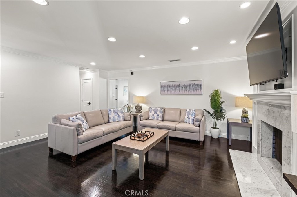 2219 Estribo Drive Rolling Hills Estates, CA 90274 - Photo 14 of 58 a living room with furniture a fireplace and a flat screen tv