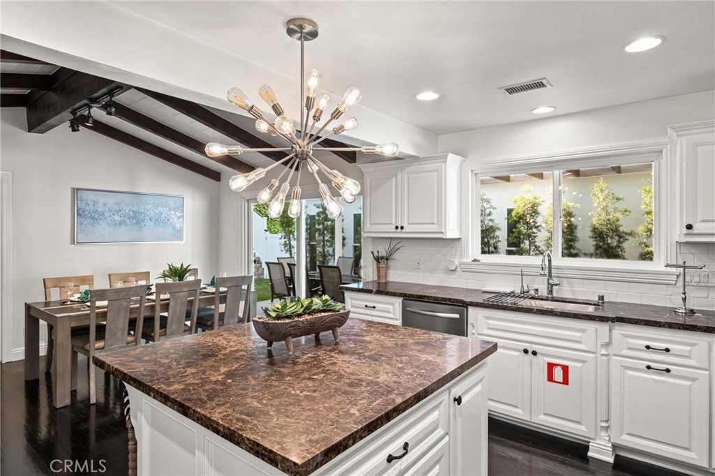 2219 Estribo Drive Rolling Hills Estates, CA 90274 - Photo 18 of 58 a kitchen with stainless steel appliances granite countertop a sink a stove and a counter top space