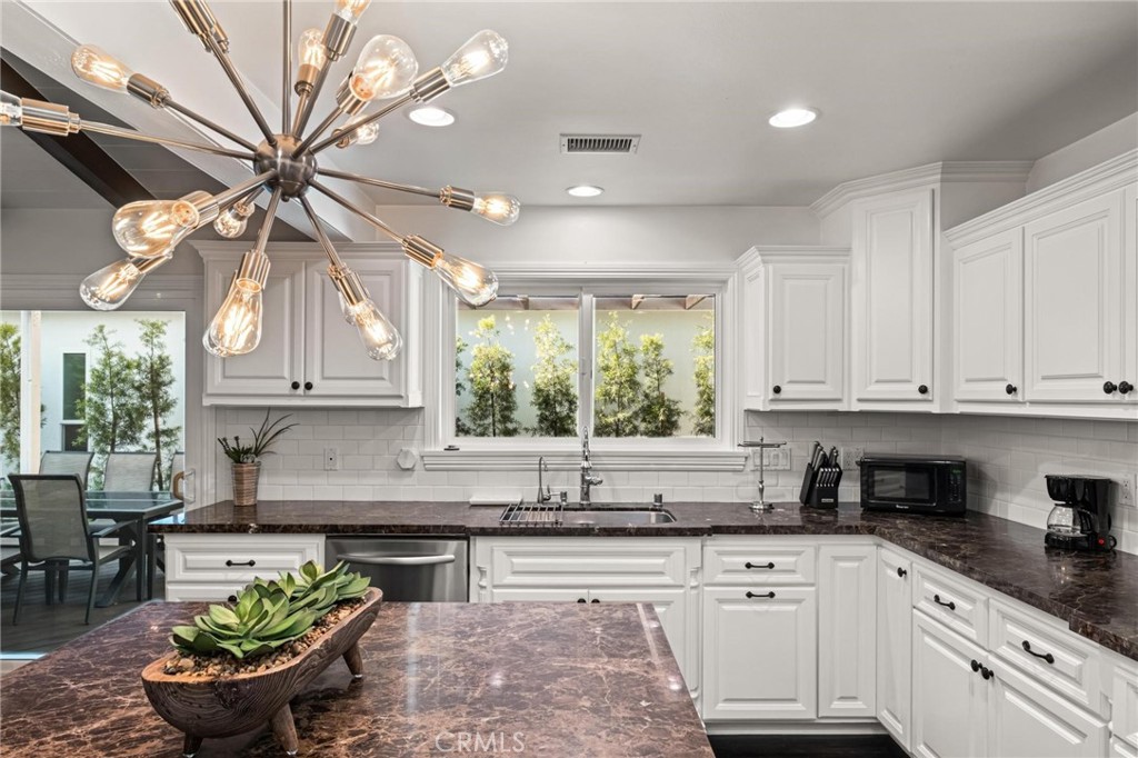 2219 Estribo Drive Rolling Hills Estates, CA 90274 - Photo 19 of 58 a kitchen with stainless steel appliances granite countertop a sink a stove and cabinets