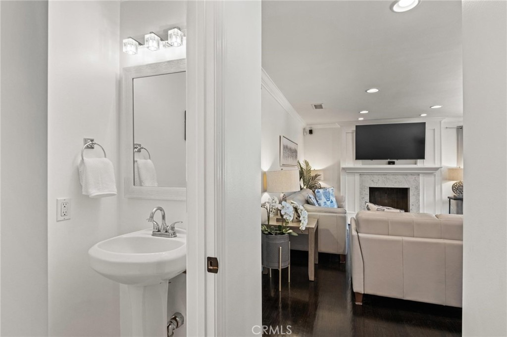 2219 Estribo Drive Rolling Hills Estates, CA 90274 - Photo 23 of 58 a living room with furniture a fireplace and a flat screen tv