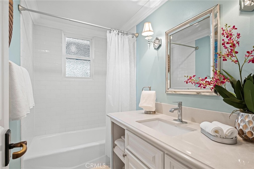 2219 Estribo Drive Rolling Hills Estates, CA 90274 - Photo 30 of 58 a bathroom with a granite countertop sink and a mirror