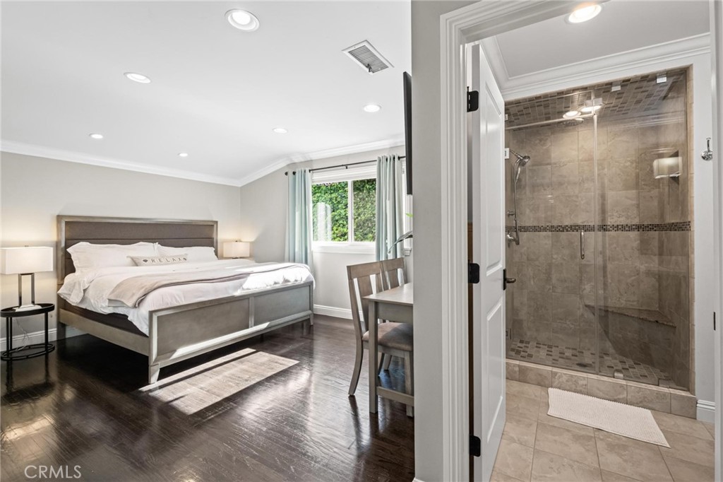2219 Estribo Drive Rolling Hills Estates, CA 90274 - Photo 35 of 58 a bedroom with a bed and a glass door shower