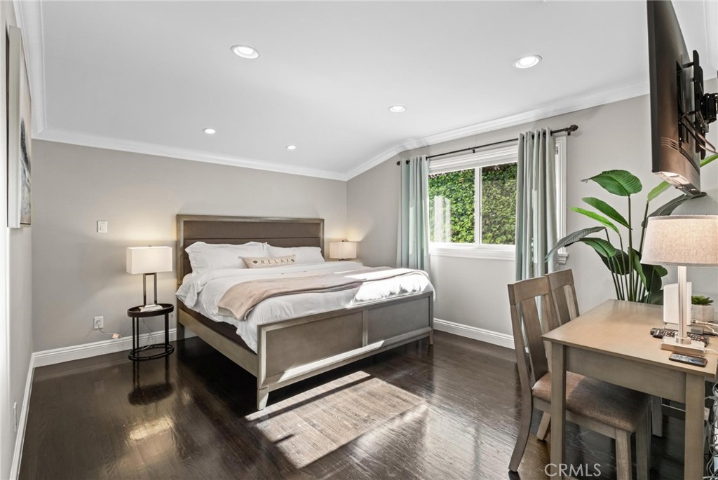 2219 Estribo Drive Rolling Hills Estates, CA 90274 - Photo 36 of 58 a bedroom with a bed table flowerpot and window