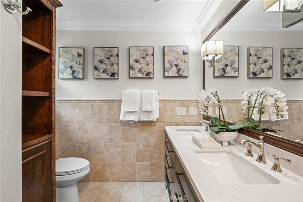 2219 Estribo Drive Rolling Hills Estates, CA 90274 - Photo 40 of 58 a bathroom with a sink toilet and mirror