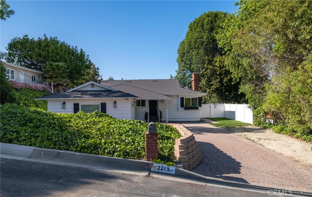 2219 Estribo Drive Rolling Hills Estates, CA 90274 - Photo 44 of 58 a front view of a house with a yard and trees