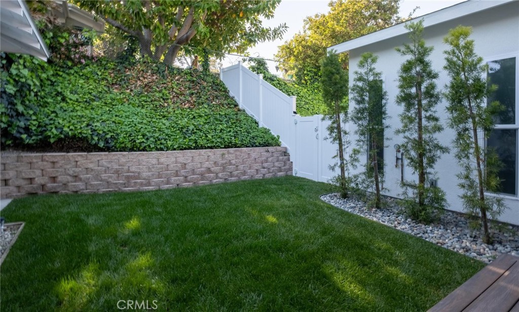 2219 Estribo Drive Rolling Hills Estates, CA 90274 - Photo 54 of 58 a view of a backyard with a plants and a large tree