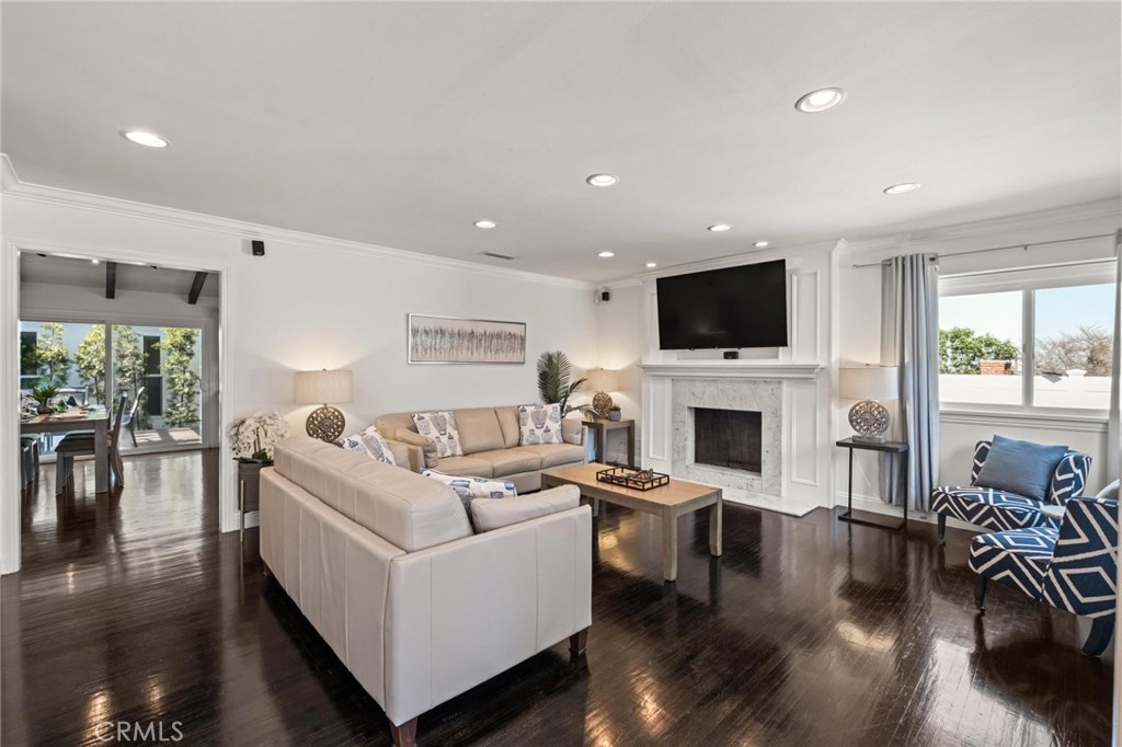 2219 Estribo Drive Rolling Hills Estates, CA 90274 - Photo 9 of 58 a living room with furniture a fireplace and a flat screen tv