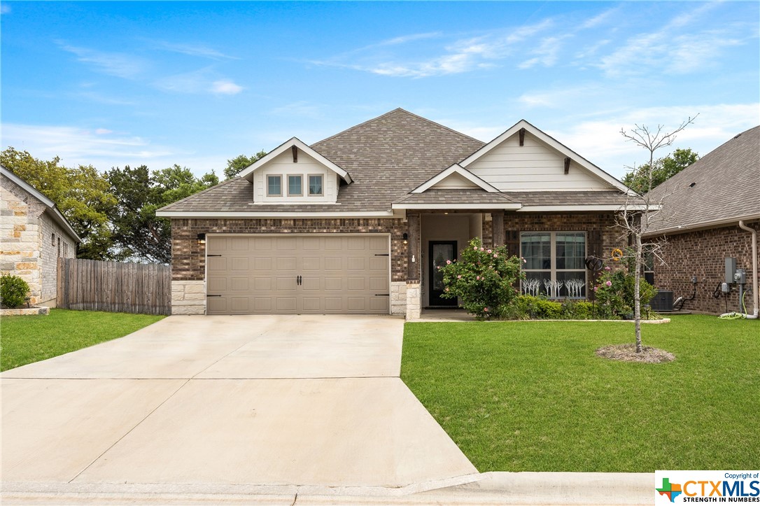 5121 Dickinson Loop Belton, TX 76513 - Photo 1 of 1 a front view of a house with garden