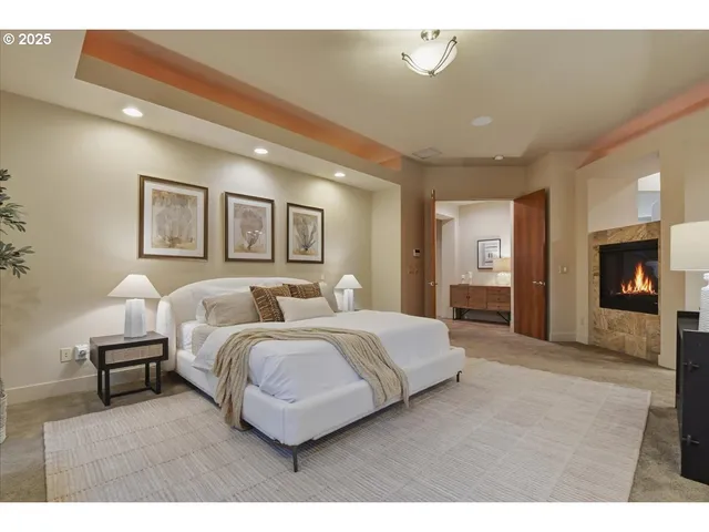 a spacious bedroom with a bed and a couch