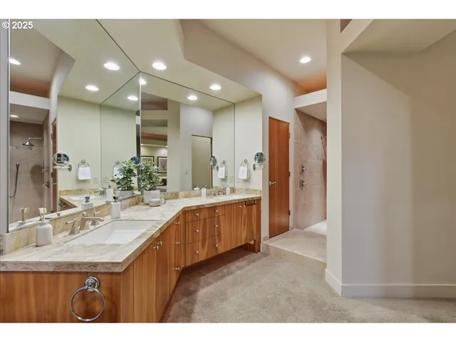 a bathroom with a sink double vanity and a mirror