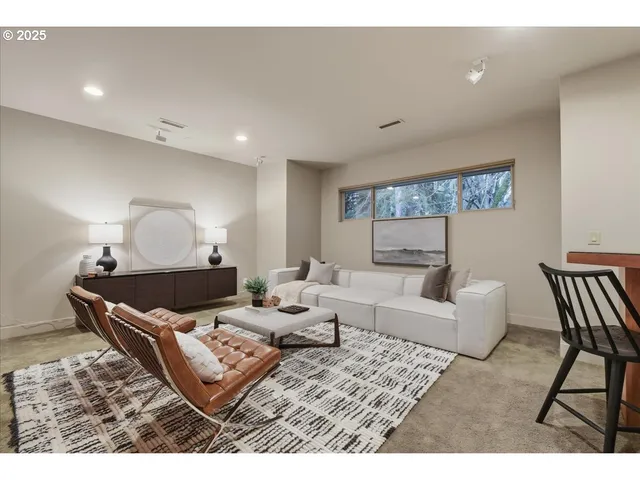 a living room with furniture and a night stand