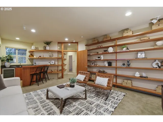 a living room with stainless steel appliances kitchen island granite countertop furniture and view living room