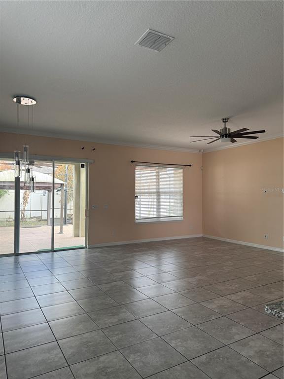 1809 Reflection Lane St. Cloud, FL 34771 - Photo 12 of 32 a view of an empty room with a window