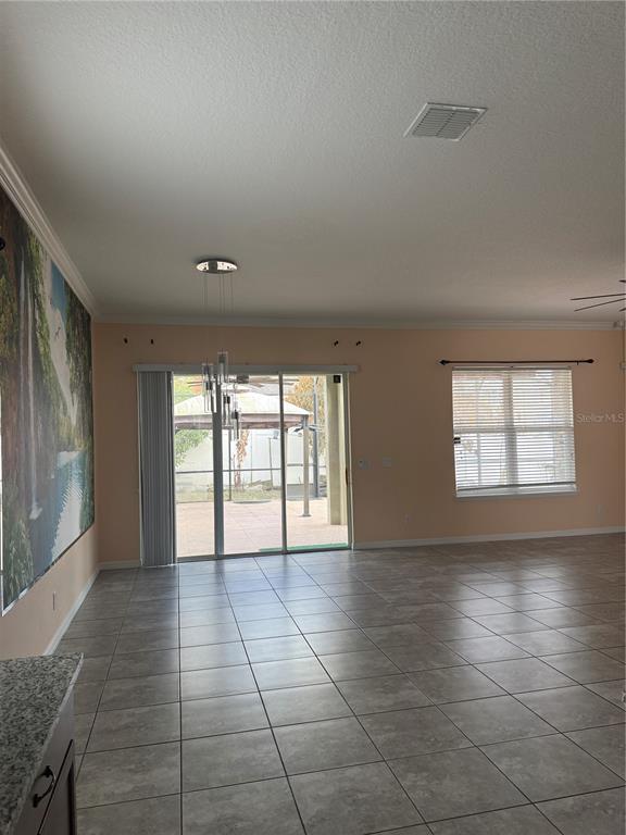 1809 Reflection Lane St. Cloud, FL 34771 - Photo 13 of 32 a view of an empty room with a window