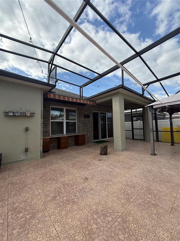 1809 Reflection Lane St. Cloud, FL 34771 - Photo 24 of 32 a view of a big room with wooden cabinet and a fireplace