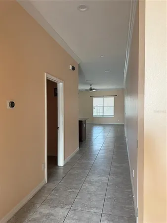 a view of wooden floor and windows in a room