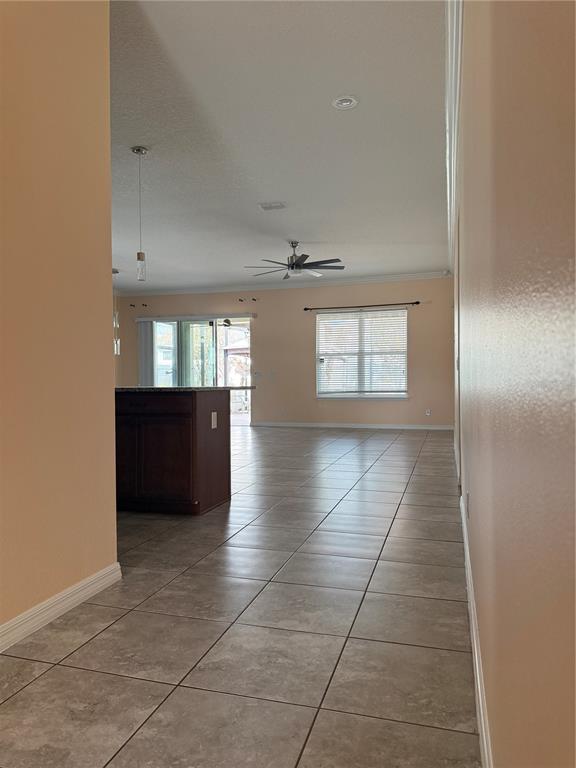 1809 Reflection Lane St. Cloud, FL 34771 - Photo 6 of 32 a view of wooden floor and windows in a room