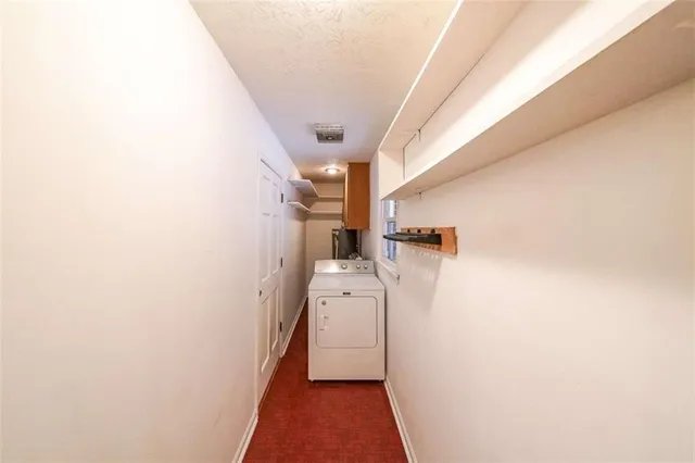 a view of a hallway with white walls