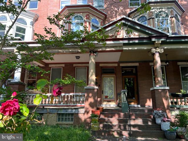 a view of a cafe with sitting area