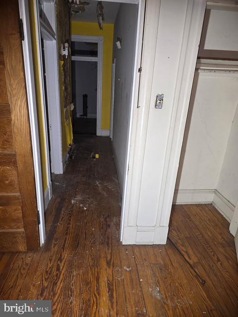 2721 North Calvert Street Baltimore, MD 21218 - Photo 11 of 29 a view of a hallway with wooden floor and staircase
