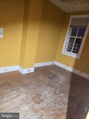 a view of an empty room with glass door