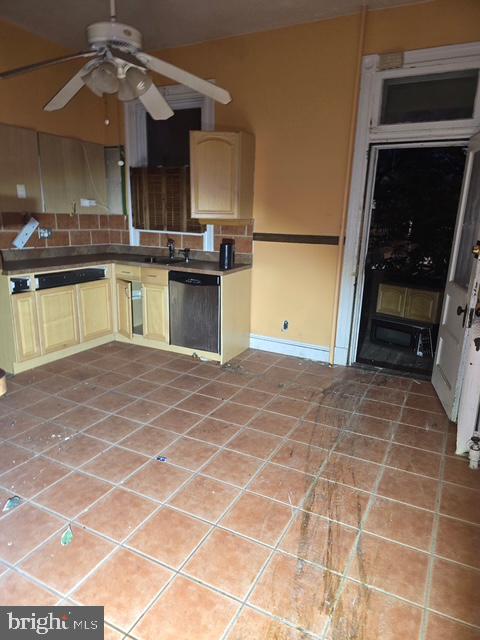 2721 North Calvert Street Baltimore, MD 21218 - Photo 20 of 29 a kitchen with a sink a stove and cabinets