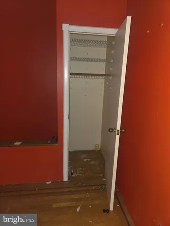 an empty room with windows and entrance