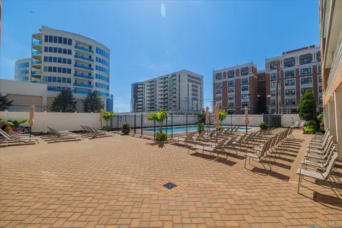 a view of a building with sitting area