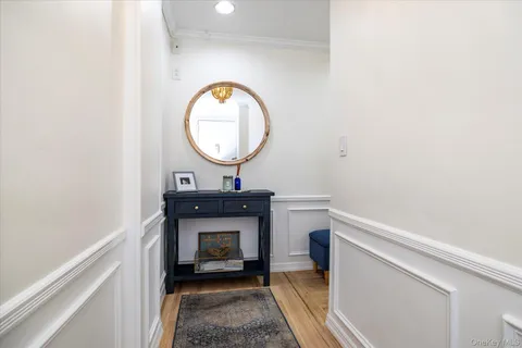 a living room with a table and a fireplace