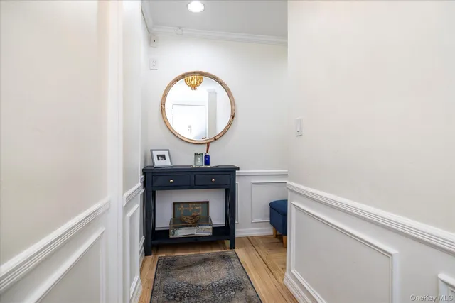 a living room with a table and a fireplace