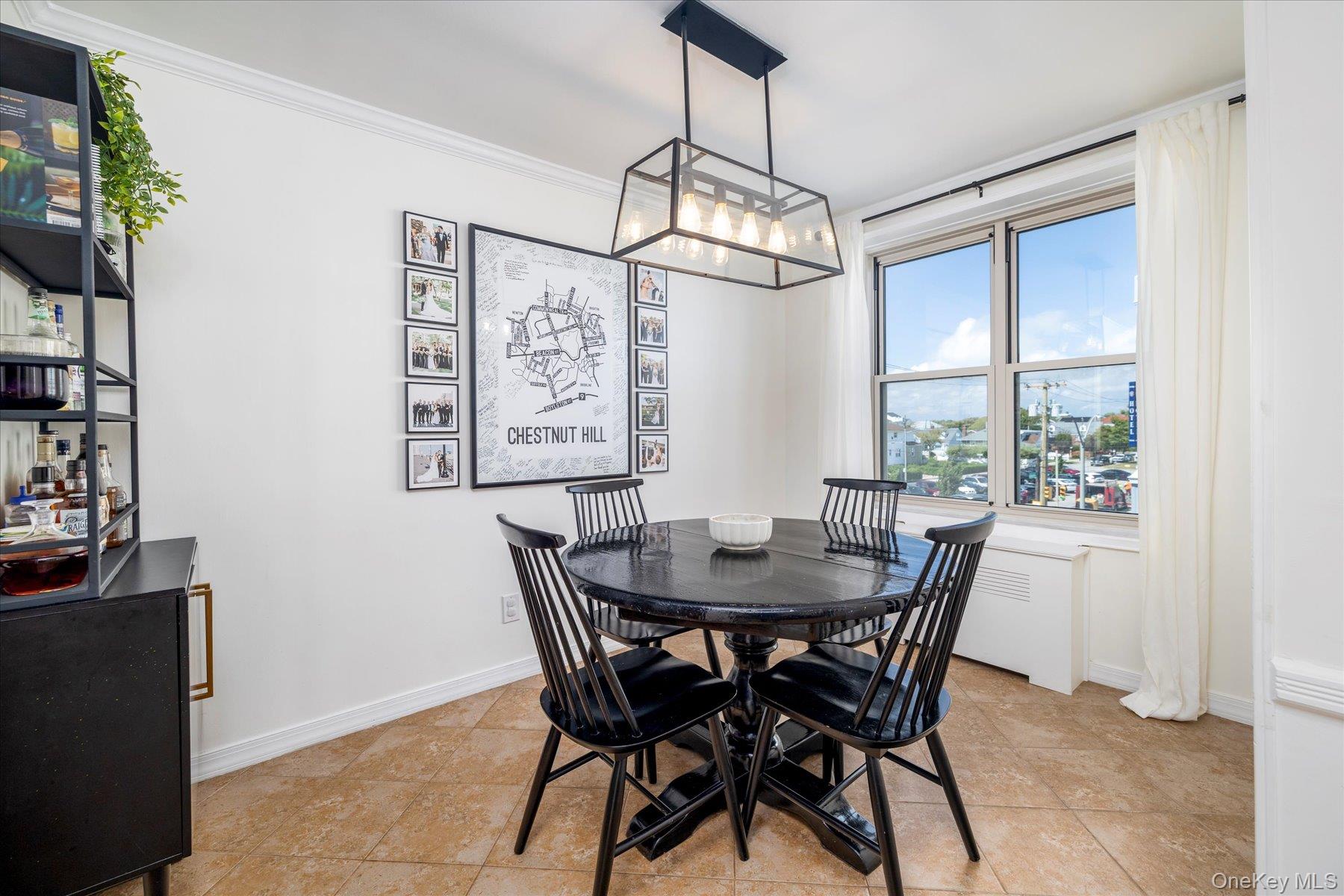 410 East Broadway, Unit 3E Long Beach, NY 11561 - Photo 10 of 23 a view of a dining room with furniture window and wooden floor