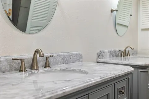 a bathroom with a shower and a sink